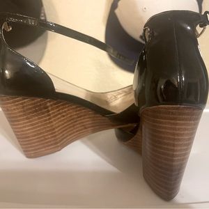 Black patent leather cole Haan strappy shoe.